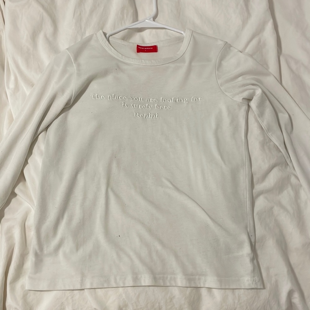 A plain white long sleeve t- shirt with some letters!